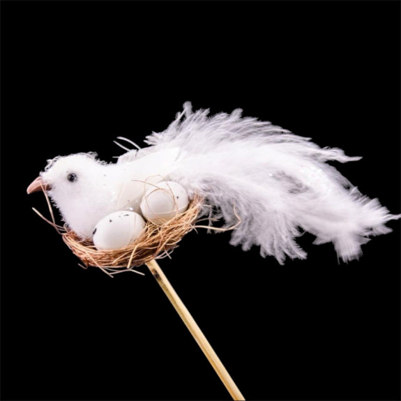 Little bird in the nest on a stick