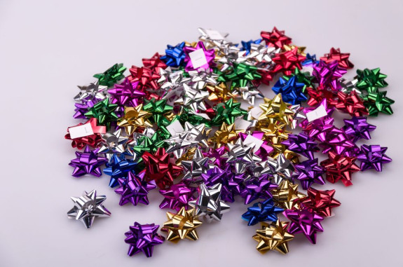 Star bows 4 cm colored metal 100 pcs.